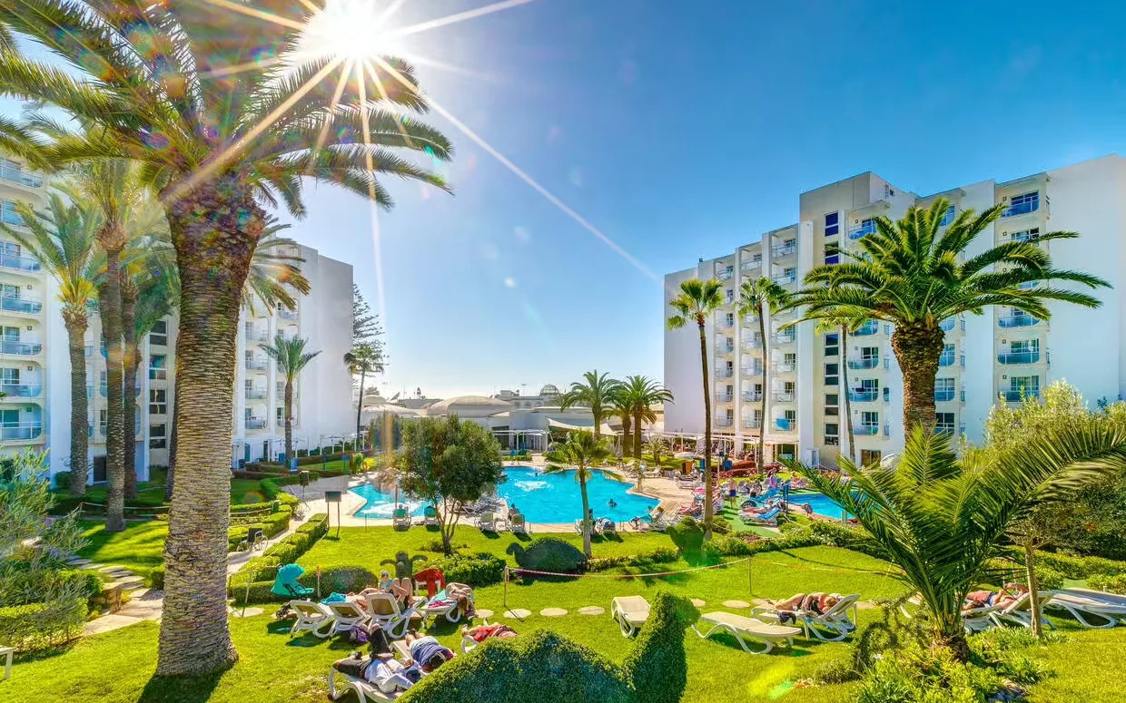 Kenzi Europa hotel entrance with flags in central Agadir — comfortable good-value recovery hotel near Agadir beach
